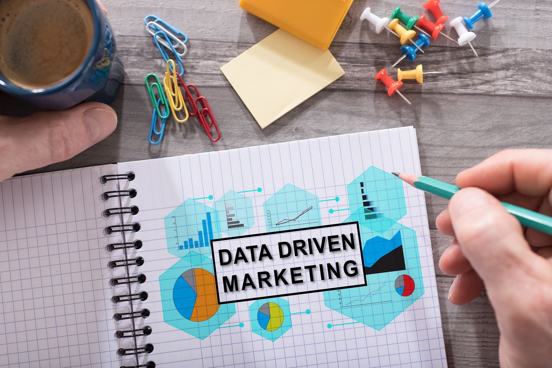 Data driven marketing concept drawn on a notepad placed on a desk